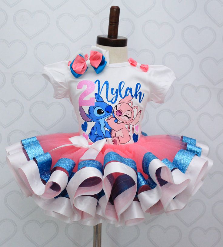 a pink and blue tutu skirted dress with an elephant on it