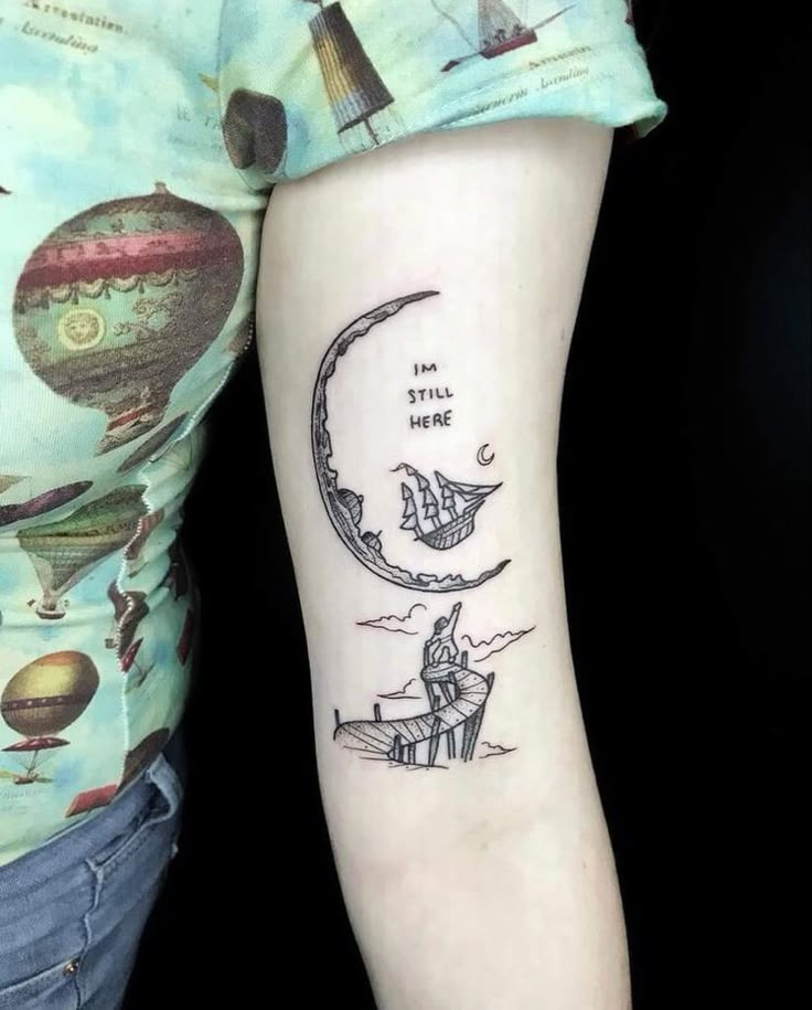 a woman with a tattoo on her arm that reads i am still here and an image of a man sitting in a boat