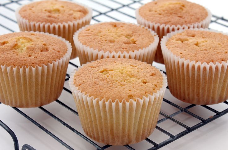 six cupcakes sitting on a cooling rack