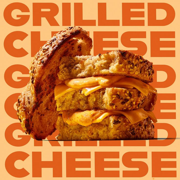 a grilled cheese sandwich is shown on an orange background