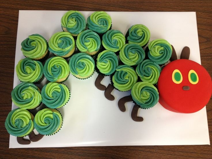 cupcakes with green and blue frosting shaped like a caterpillar