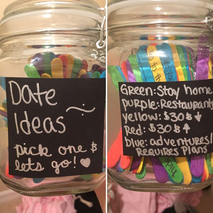 two jars filled with different colored pins and labels on the lids, one has a note attached to it