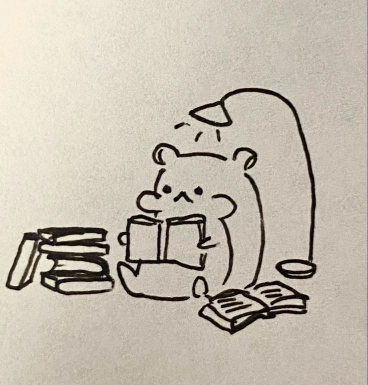 a black and white drawing of a bear holding a book while sitting at a table