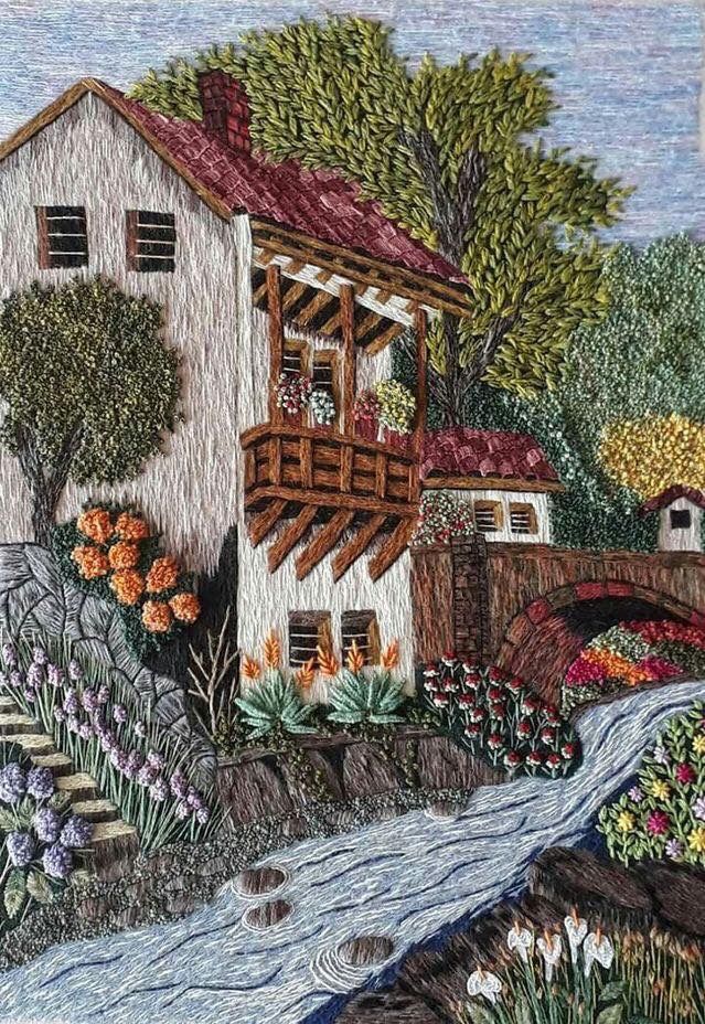 a drawing of a house by the river