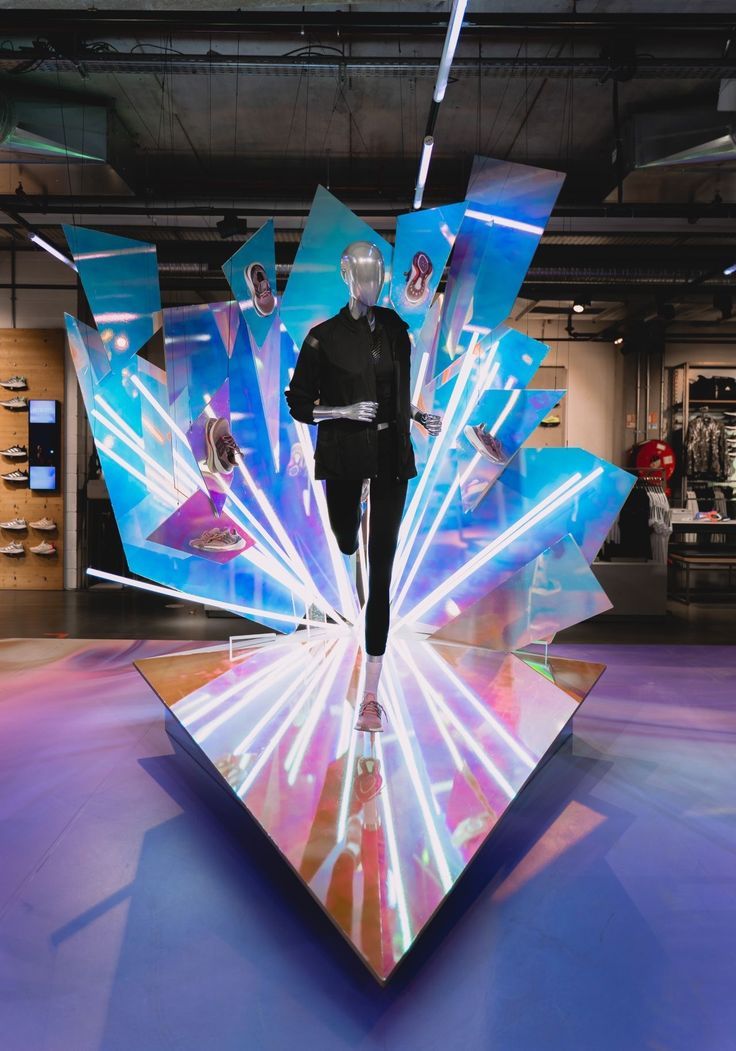 a man standing on top of a colorful display