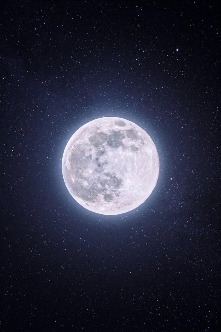 the full moon is shining brightly in the night sky