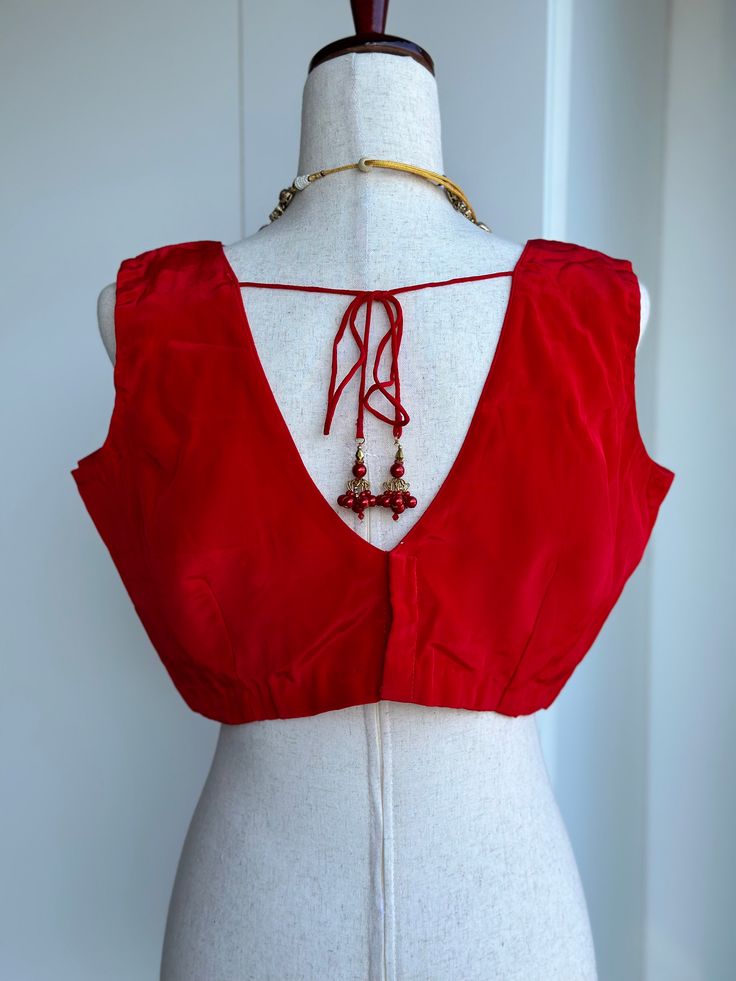 Blouse size 38-42 crape silk sleeveless blouse Silk Sleeveless Blouse For Party, Red Silk Sleeveless Top, Silk Red Padded Blouse Piece, Red Sleeveless Unstitched Blouse Piece, Red Unstitched Sleeveless Blouse Piece, Elegant Sleeveless Blouse Piece For Summer, Elegant Red V-neck Blouse Piece, Elegant Sleeveless Padded Blouse, Silk Sleeveless Padded Blouse Piece