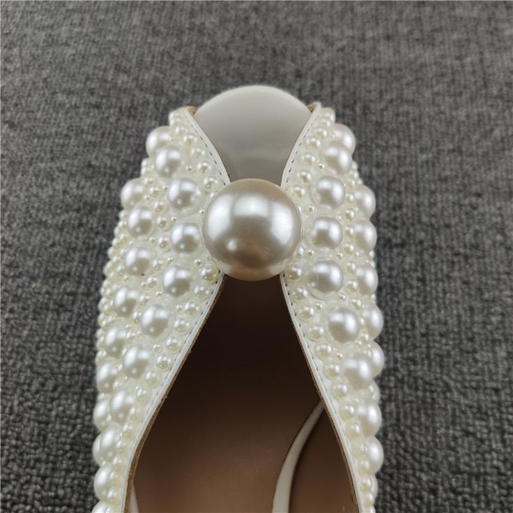 SPECIFICATIONS Indulge in a luxurious look with these pearl studded heels sandals! Crafted with comfortable PU upper material, these sandals feature an open toe style and solid pattern, with just the right heel height (3cm-5cm). You are sure to turn heads while your feet are cradled in total comfort with a rubber outsole, PU lining, and rubber insoles. Slip-on fit true to size for the perfect casual evening look! With Platforms: No Upper Material: PU Toe style: open toe heels Size: 34 35 36 37 3 Buy Pearls, White Sandals Heels, Open Toe Heels, Strung Beads, Studded Heels, Pearl Leather, Casual Evening, Evening Look, Women Sandals