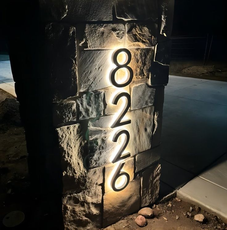 a lit up brick wall with numbers on it