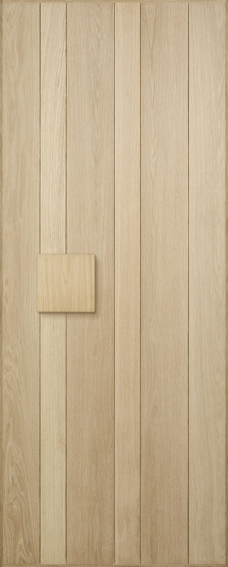 a close up of a wooden door with a square handle on the front and side panel