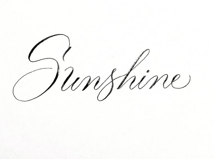 the word sunshine written in cursive ink