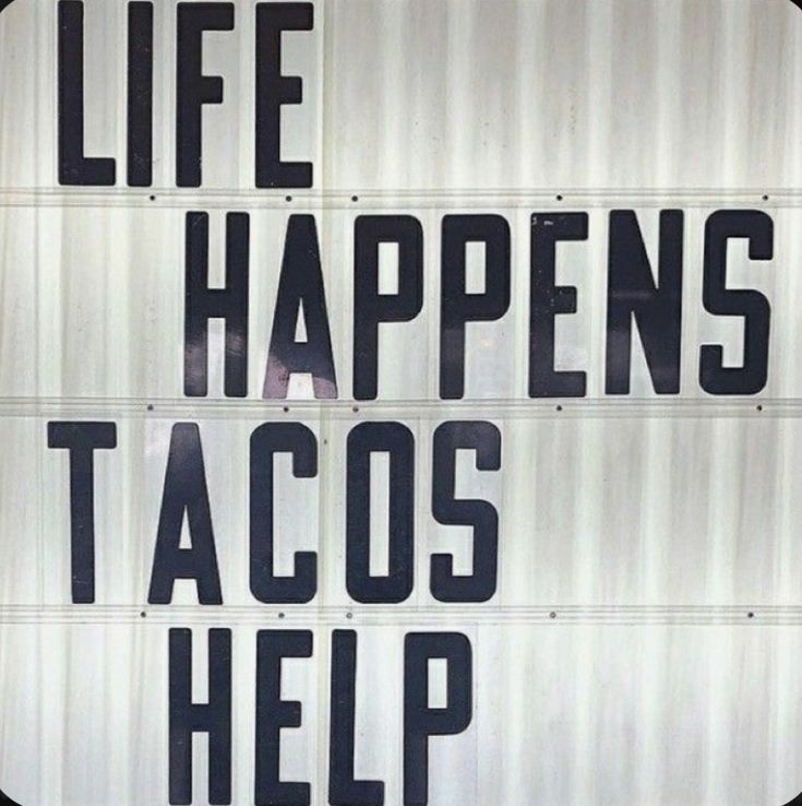 a sign that says life happens tacos help