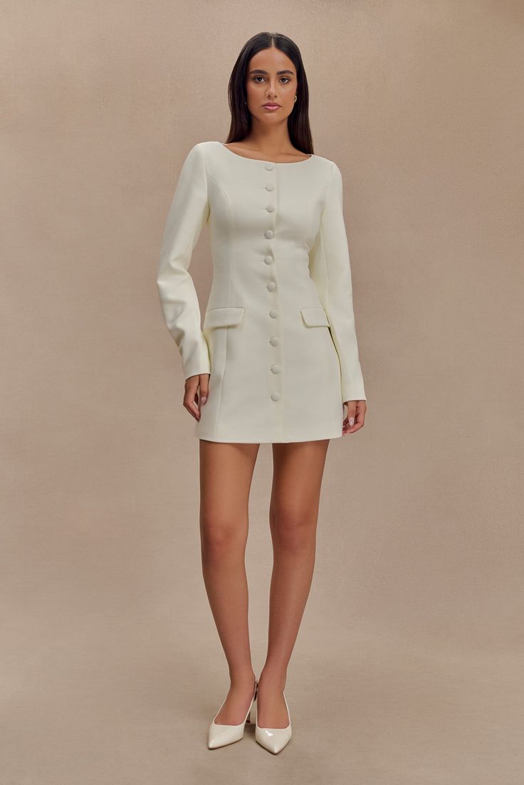 Timeless tailoring. The JOLIE Boat Neck Suiting Mini Dress epitomises refined sophistication with its classic boat neckline and structured shoulders that create a polished, tailored look. The button front closure adds a touch of elegance, while the long sleeves provide a versatile, sophisticated silhouette. The fitted waist accentuates your shape, and the flared skirt adds a playful, feminine touch. Perfect for professional settings or special occasions, the Jolie Dress seamlessly combines timel Church Clothes, Classic Boat, Fall Wear, Dresses Outfits, Fall Outfits For Work, Graduation Outfit, Church Outfits, Office Dresses, Dress Long Sleeve