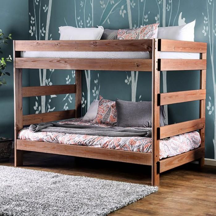 a wooden bunk bed sitting on top of a hard wood floor next to a plant