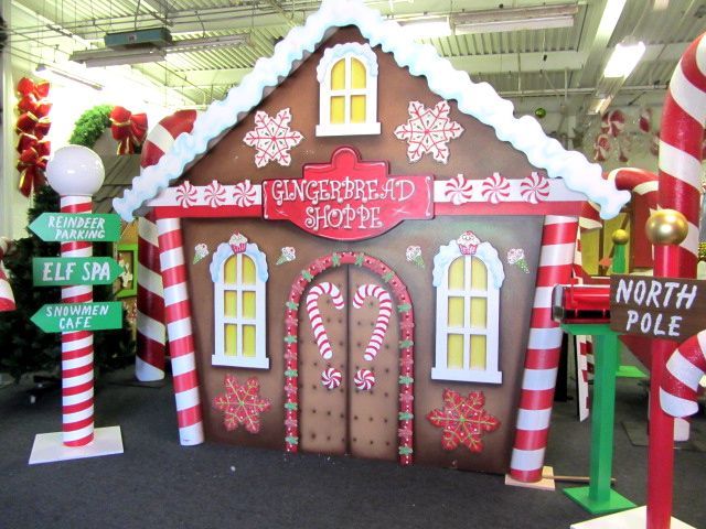 a large gingerbread house decorated with candy canes