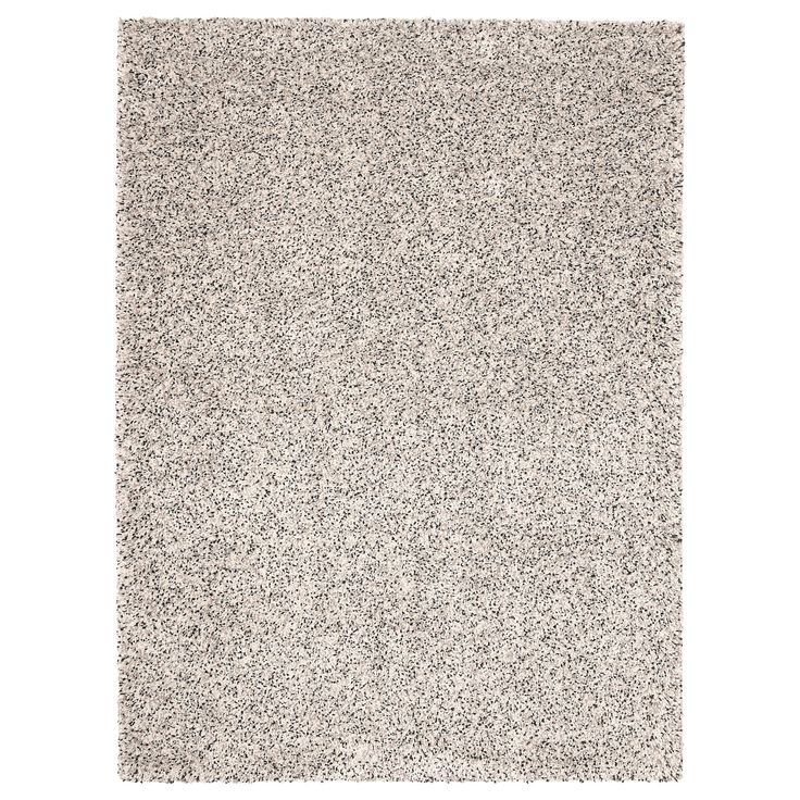 an area rug with white and gray speckles