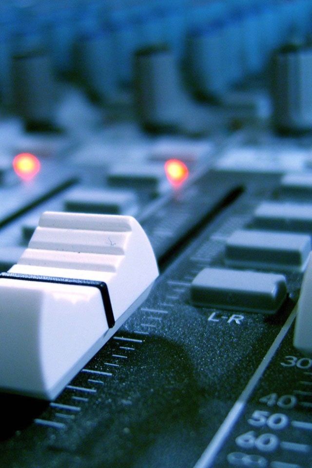 an audio mixing board with the words if music be the food of love play on