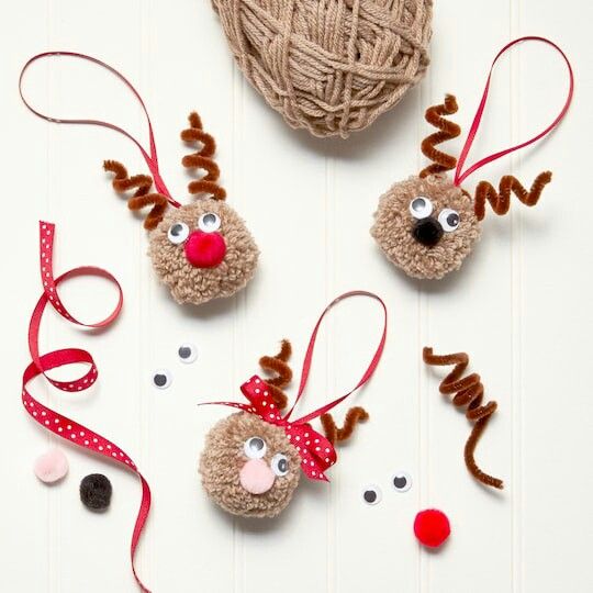 three reindeer ornaments made out of yarn and twine