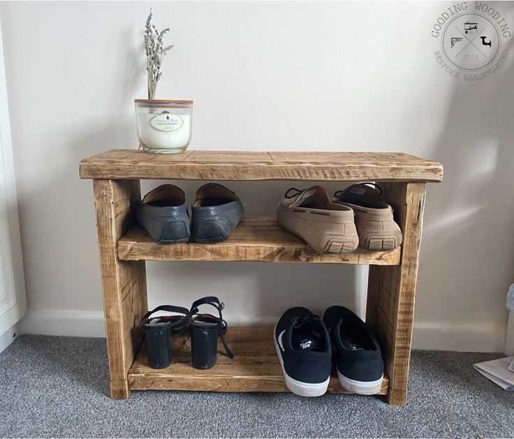 shoes are lined up on a wooden shelf