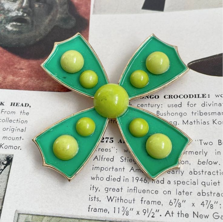 "- Vintage Mod Brooch - Made by WEISS (Stamped) - Measures: 2.25\" x 2.25\" - Colors: Green, Neon Green and Gold - Excellent vintage condition >> Before Albert Weiss founded his own jewelry company in 1942, he learned the tricks of the trade as a designer for Coro in the 1930s. Weiss excelled at floral and figural brooches and earrings, but expanded to bracelets and necklaces. Weiss is perhaps best known for his use of smoky rhinestones. The company was also one of the first to use Swarovski's p Retro Green Brooch Jewelry, Green Brooch Enamel Pin For Gift, Green Enamel Brooch Pin As Gift, Green Enamel Pin Brooch For Gift, Retro Enamel Brooch Pins, Vintage Green Pins For Gifts, Vintage Green Pins As Gift, Vintage Green Pins For Gift, Green Enamel Pins