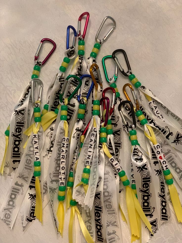 a bunch of lanyards that are laying on the ground together with some tags attached to them