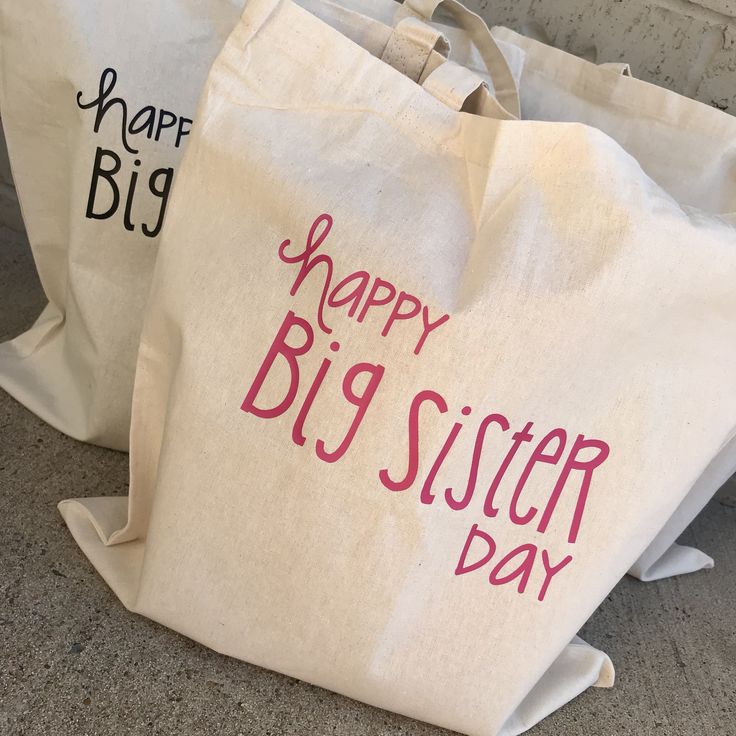 two bags with happy sister day written on them