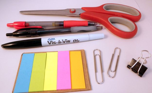 Scissors, pens, clips, and post-it flags