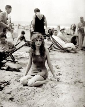 Young lady enjoying a day at the beach, France, ca 1920