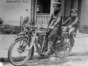 Louis (age 14) and Temple (age 10) Abernathy, brothers on their motorcycle trip from Oklahoma to New York City, 1913