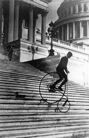 Riding a bicycle down the steps of the United States Capitol. 1884