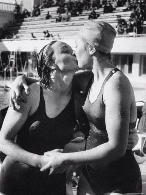 Maria Gavrish (left) congratulates her friend Elena Kovalenko, who defeated her during the breaststroke swimming competition at the USSR Championships in Moscow, 1956