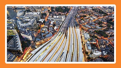 Aerial view of London bridge railway station with tower bridge in the background