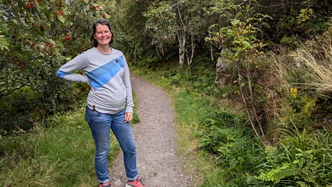 Heather Beaton stands on a woodland path (Credit: Jocelyn Timperley)