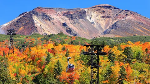 Chairlifts on the Asahidake Ropeway in Daisetsuzan National Park, Hokkaido, Japan, during the autumn season (Credit: Alamy)