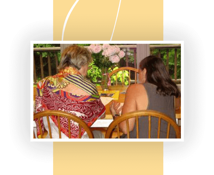 Behind image of two girls sitting on the chairs