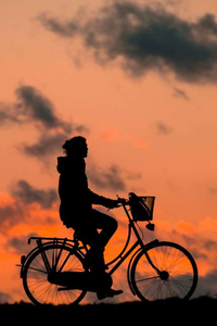 Cyclist Chasing Sky (1080x2160) Resolution Wallpaper