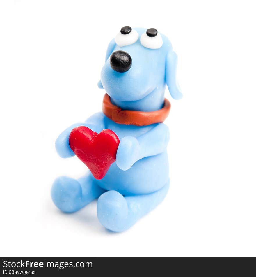 Miniature polymer clay blue dog offering his heart. Miniature polymer clay blue dog offering his heart.