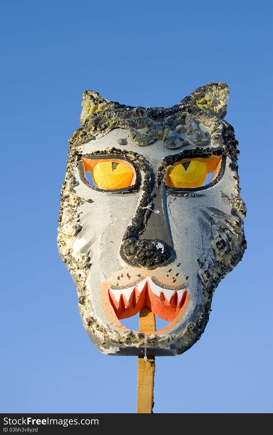 Mardi Gras wolf mask on sky background