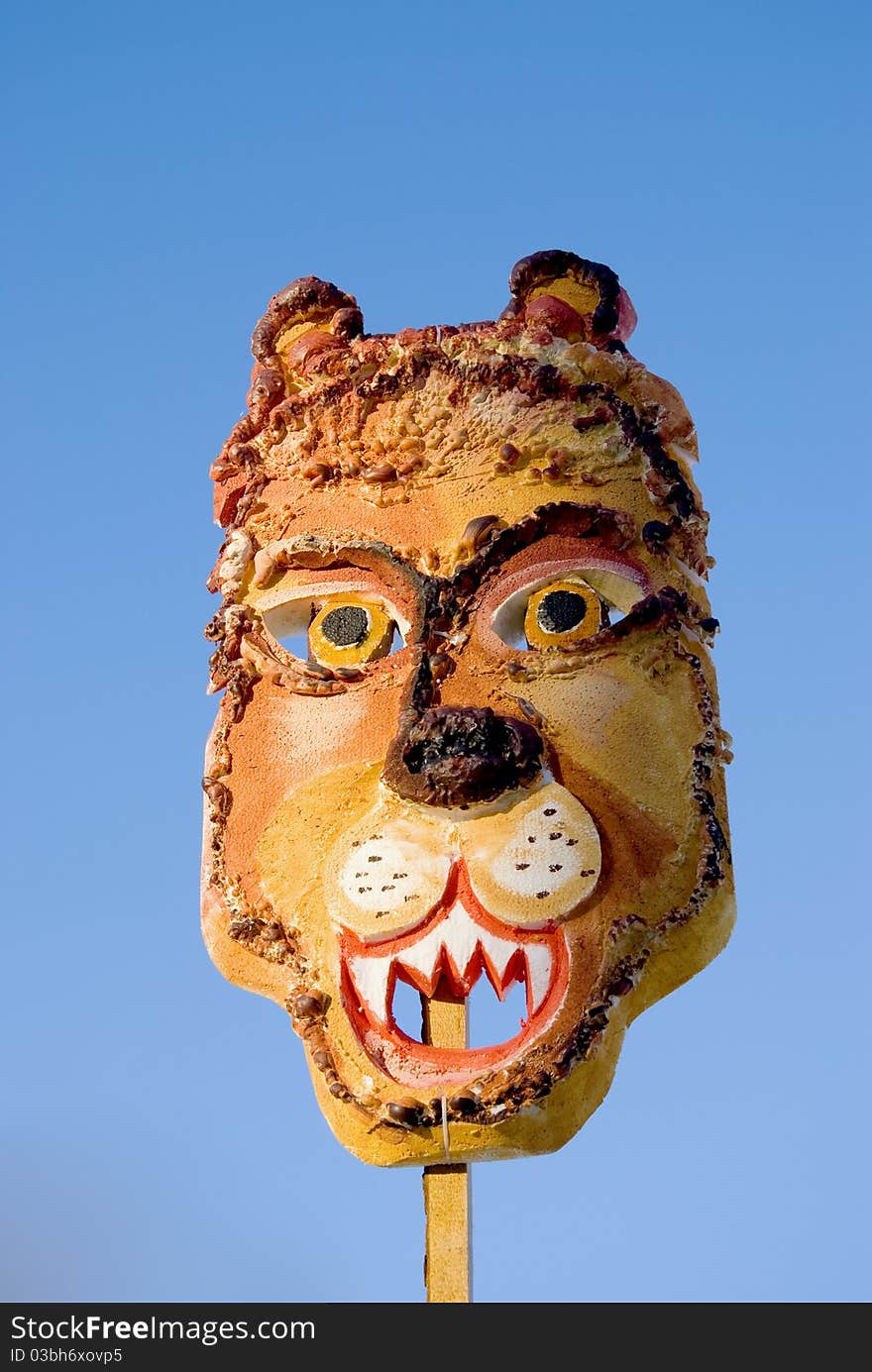 Mardi Gras lion mask and sky