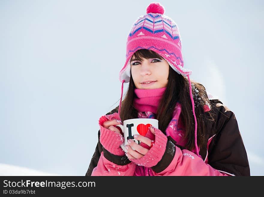 Winter girl with the cup of tea