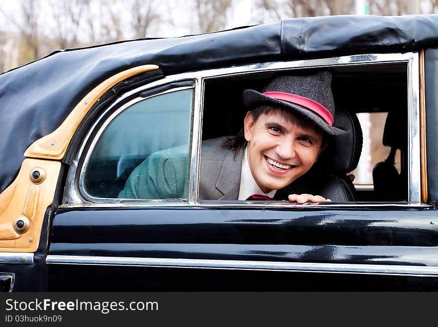 Smile happy groom in retro car. Smile happy groom in retro car