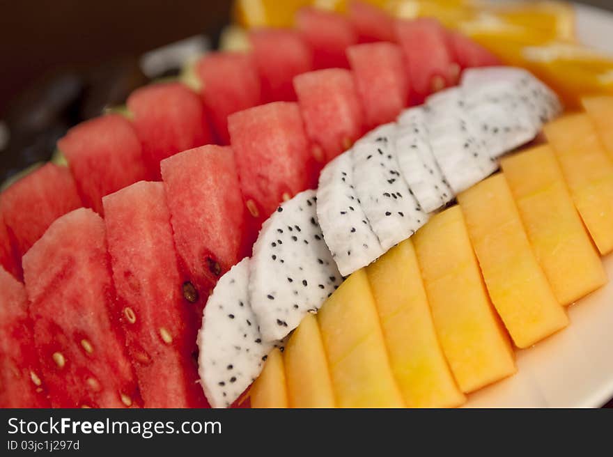 Nicely cut and arranged fruits on a platter tray ready to be served. Nicely cut and arranged fruits on a platter tray ready to be served.