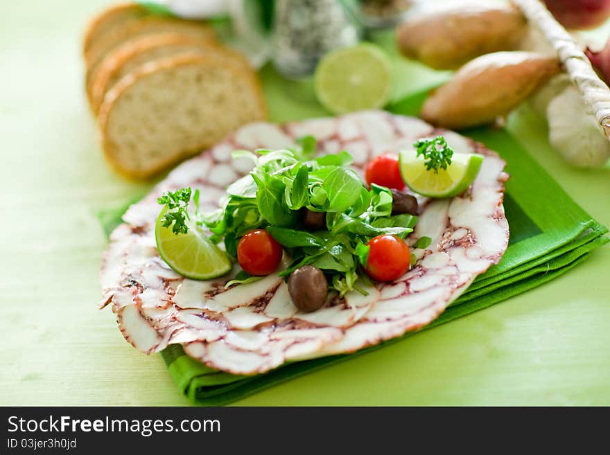 Octopus Carpaccio with mixed salad