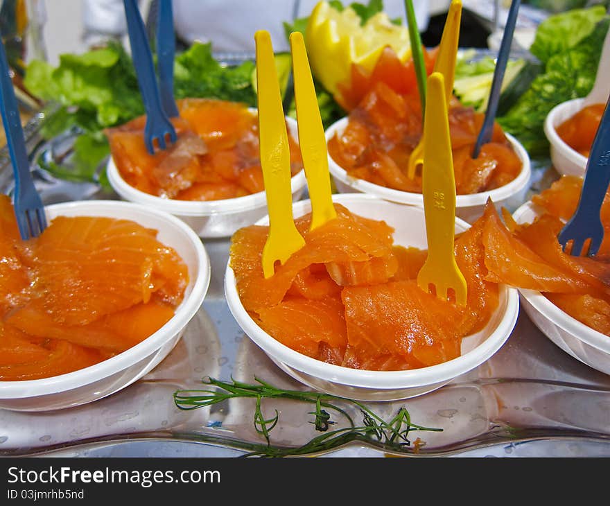 Smoked salmon appetizer on a buffet.