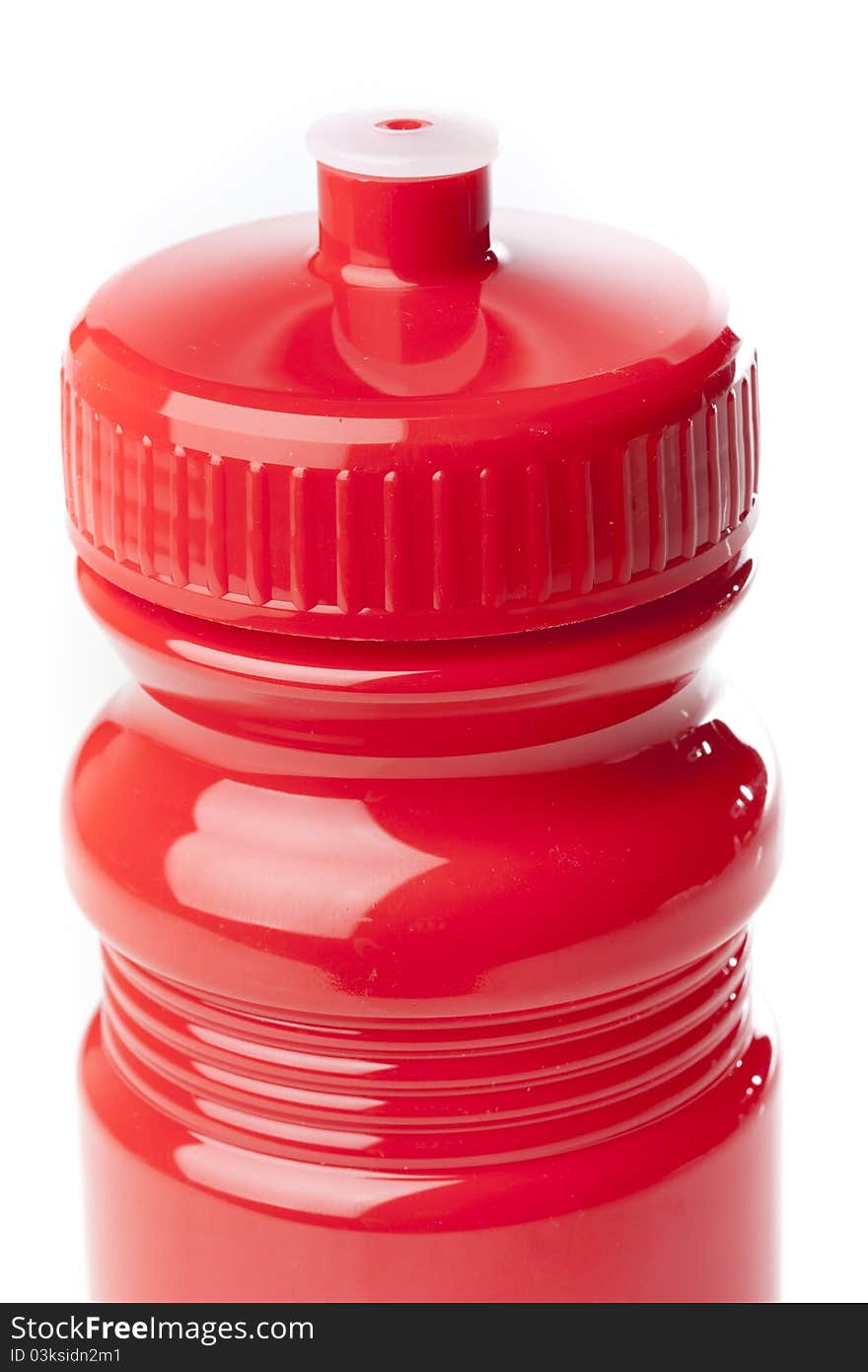 A red water bottle against a white background