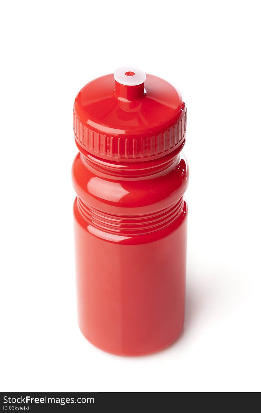 A red water bottle against a white background