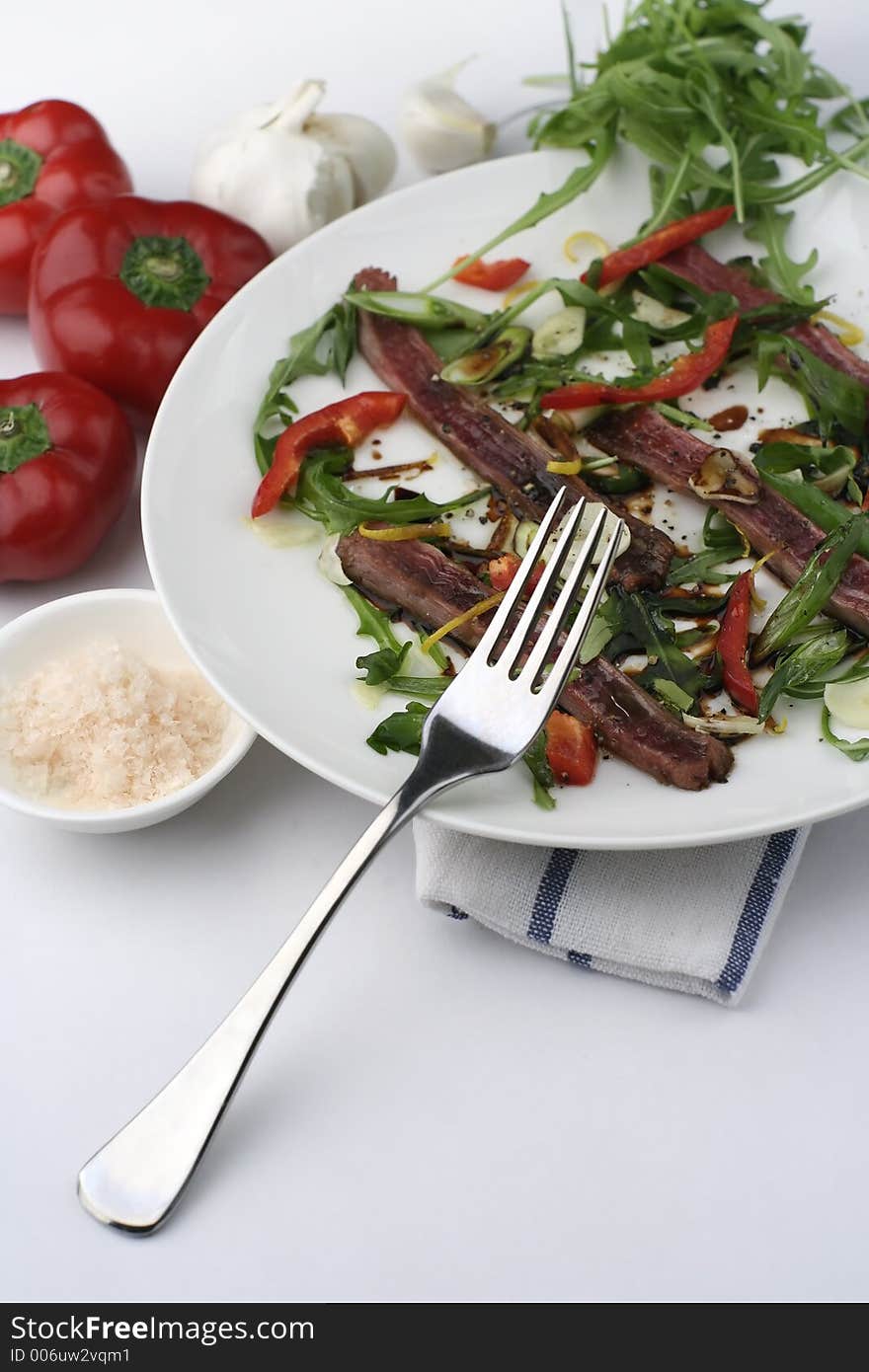 Beef Carpaccio; tall view with fork