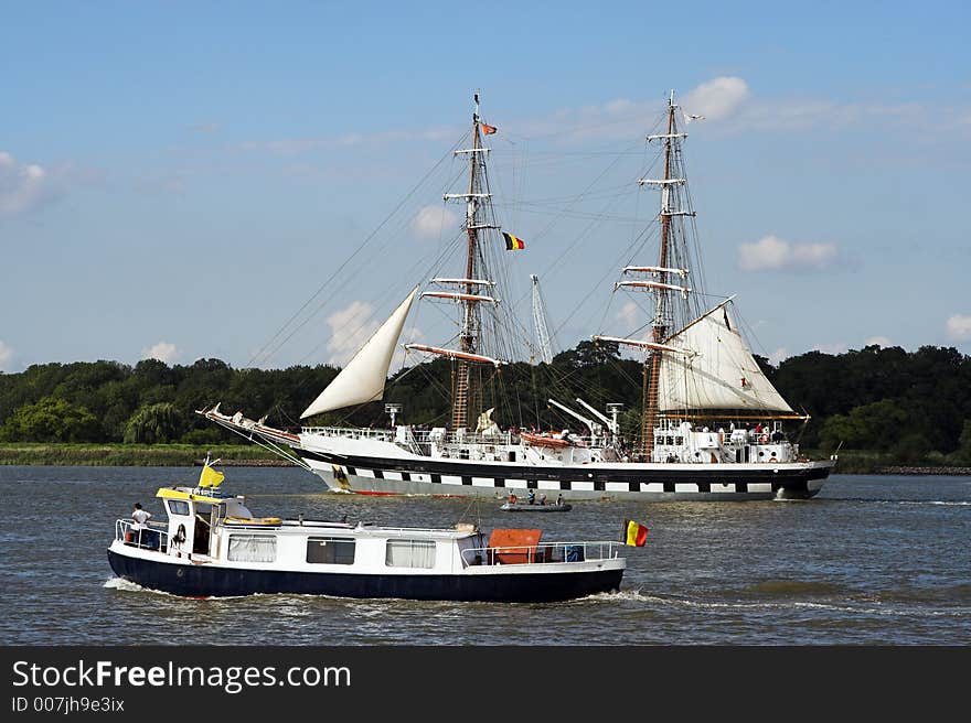 Two-masted ship parading on the river Scheldt in Antwerp, during the 50th Tall Ships Race of 2006. Two-masted ship parading on the river Scheldt in Antwerp, during the 50th Tall Ships Race of 2006