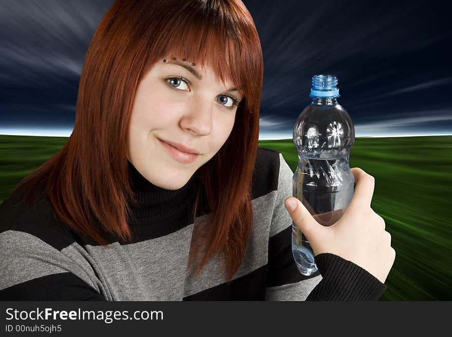 Redhead girl holding water bottle