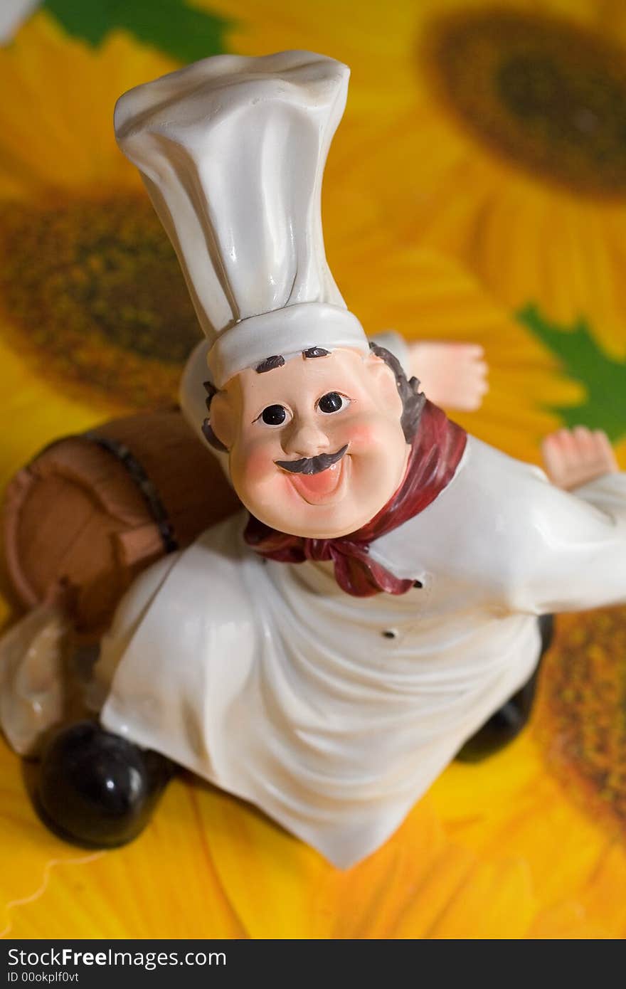 Figurine of the cook on the background